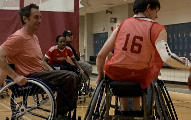 Students in wheelchairs compete in a basketball game as part of River City Rollers at the IU South Bend campus.