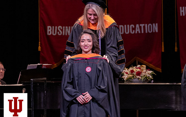 two people in academic regalia