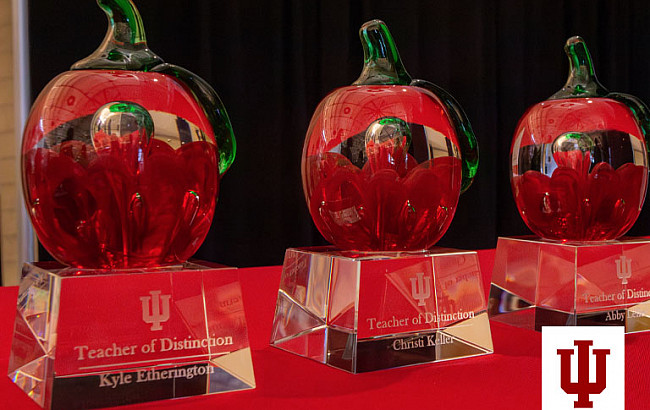 A grouping of red blown glass apples