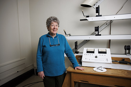 Catherine Pilachowski stands in front of a solar telescope