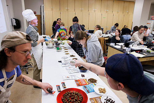 Students make their way through the line for an insect cuisine buffet during the final meeting of the lab section of BIOL-Z 373 Entomolog...