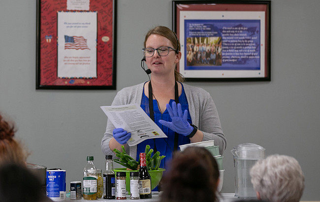 A woman gives a presentation about food