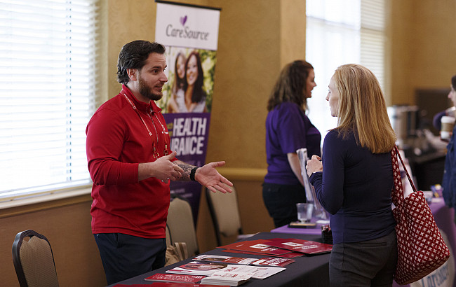An IU rep speaks to a community member