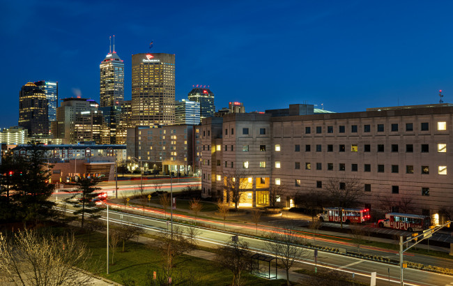 The Informatics and Communications Technology Complex building at IUPUI with the Indy skyline in the background.