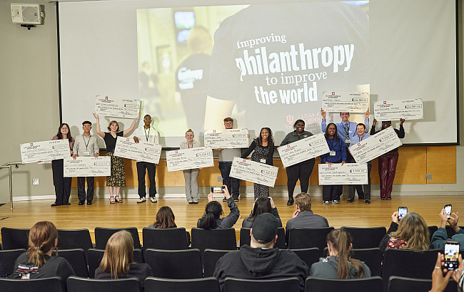 Winners of the Inaugural Pitch Your Passion competition hold the ceremonial checks of their scholarship funds, which go toward earning a ...