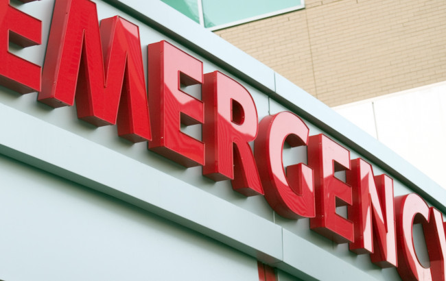 Large red emergency sign on hospital entrance