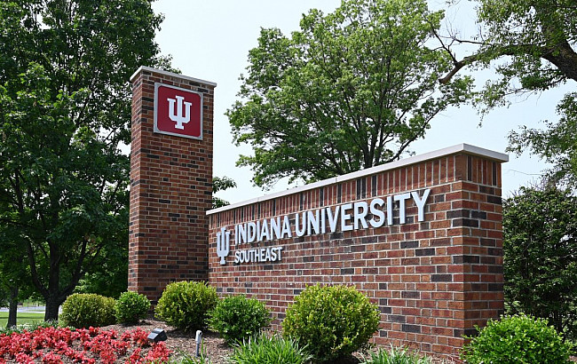 Brick signage at entrance of campus with trident and Indiana University Southeast