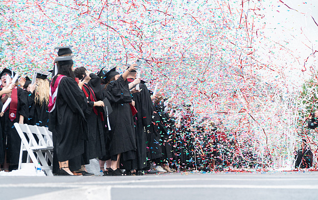 graduates throwing confetti