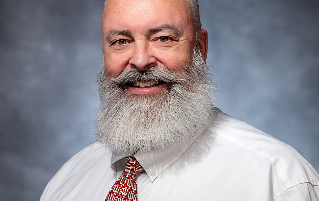 Man with a beard wearing a red tie