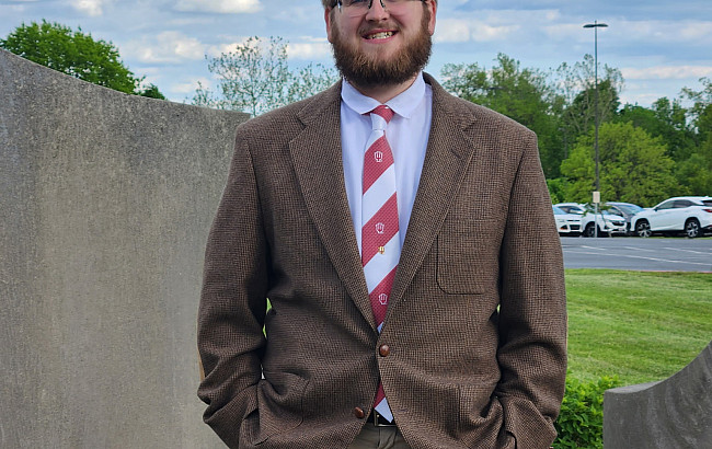 man standing in a suit and tie