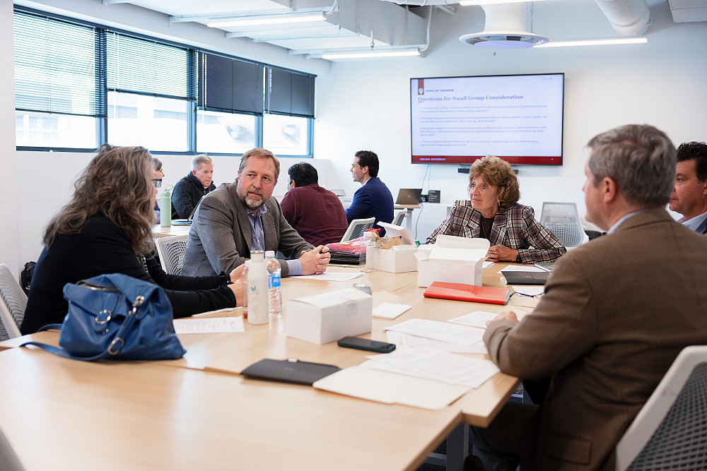 IU LAB Academic Gateway task force members chat during a meeting