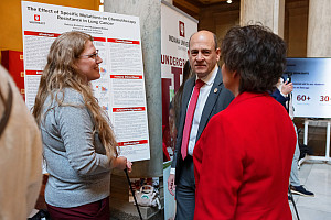 A student discusses their research at Regionals at the Rotunda