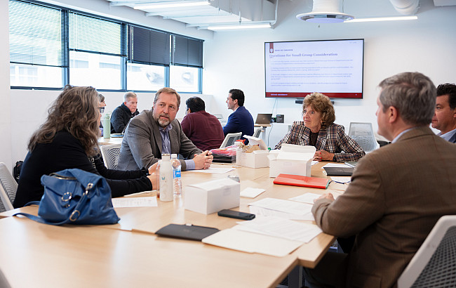 IU LAB Academic Gateway task force members chat during a meeting