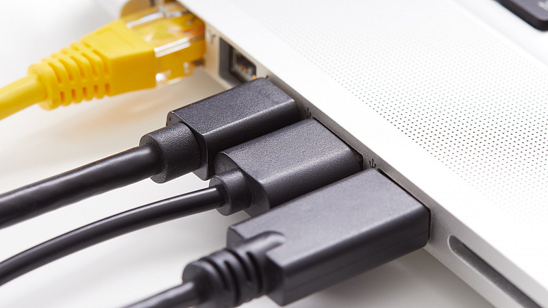 Several power plugs on a laptop