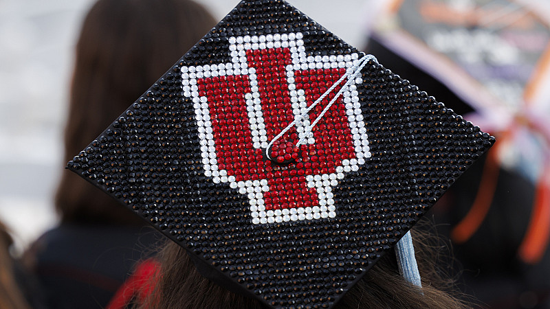 A graduation cap decorated with the IU trident.