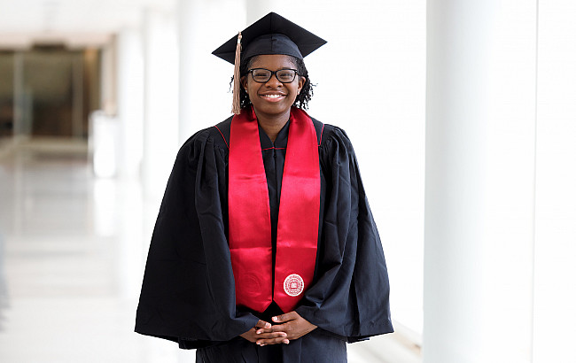 Undergraduate commencement speaker London Okowa posed for a photograph at the University Library.