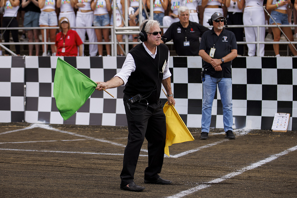 Chap Blackwell waves the green flag to start the 34th Women's Little 500 at Bill Armstrong Stadium on April 22, 2022. Photo by James Bros...