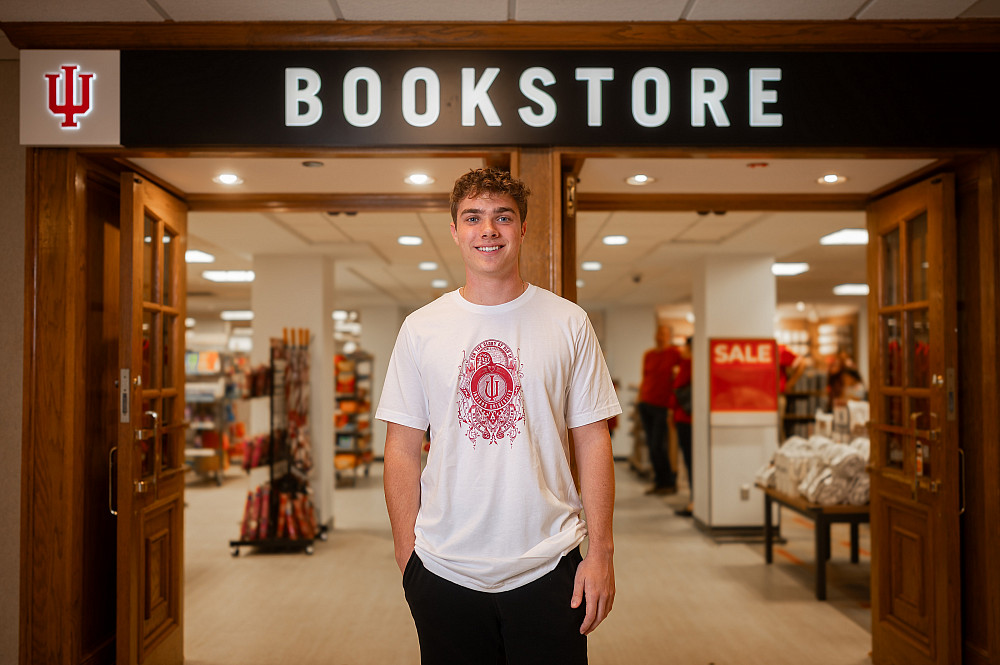 Sam Cosner, winner of the Indiana University Bloomington Student-Designed T-Shirt Contest, poses with his winning design in the IU Bookst...