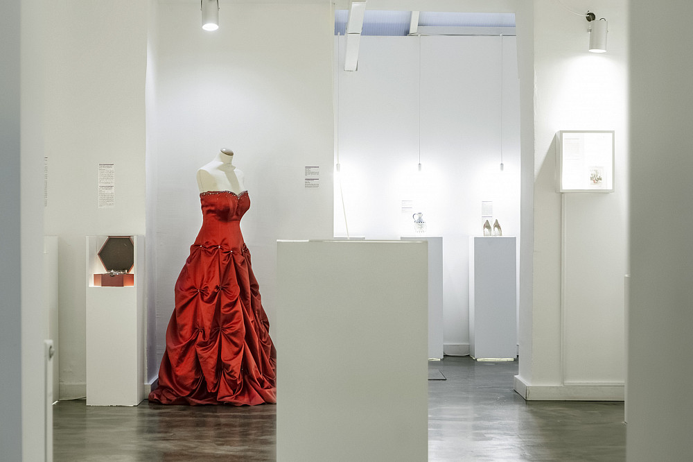 Red gown on display in a museum