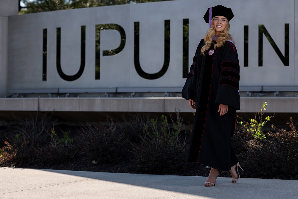 Mikki Jaramillo, a senior at IUPUI, who is graduating from the IU School of Dentistry, poses for a photograph at the Shreve Gateway on Th...