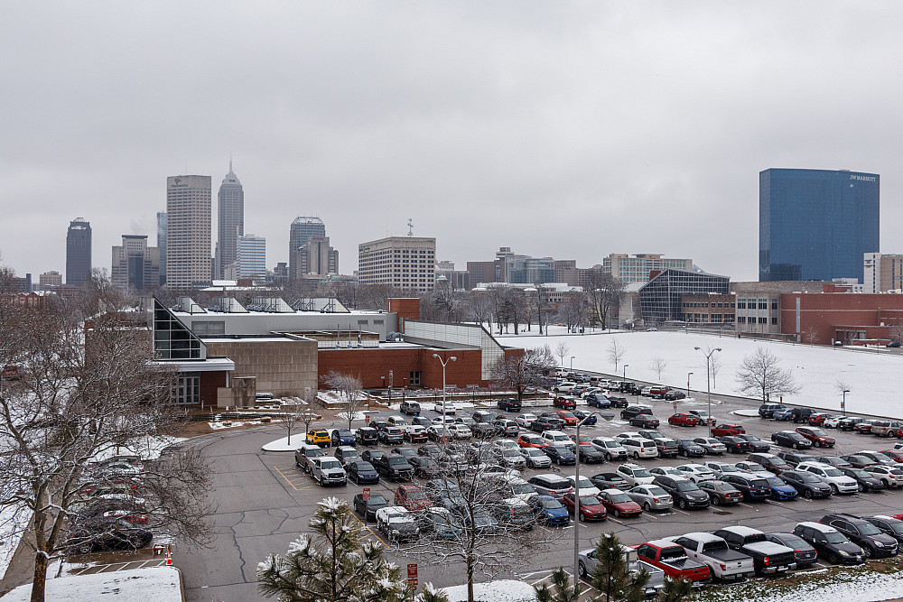 Aerial view of parking lot and skyline.