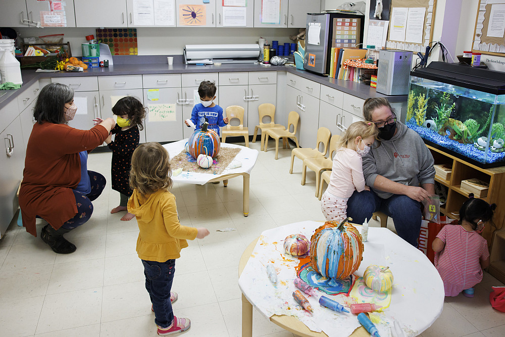 Teachers Jennifer Addleman, left, and Samantha Sisk work with toddlers in their class at the Campus View Child Care Center at IU Blooming...