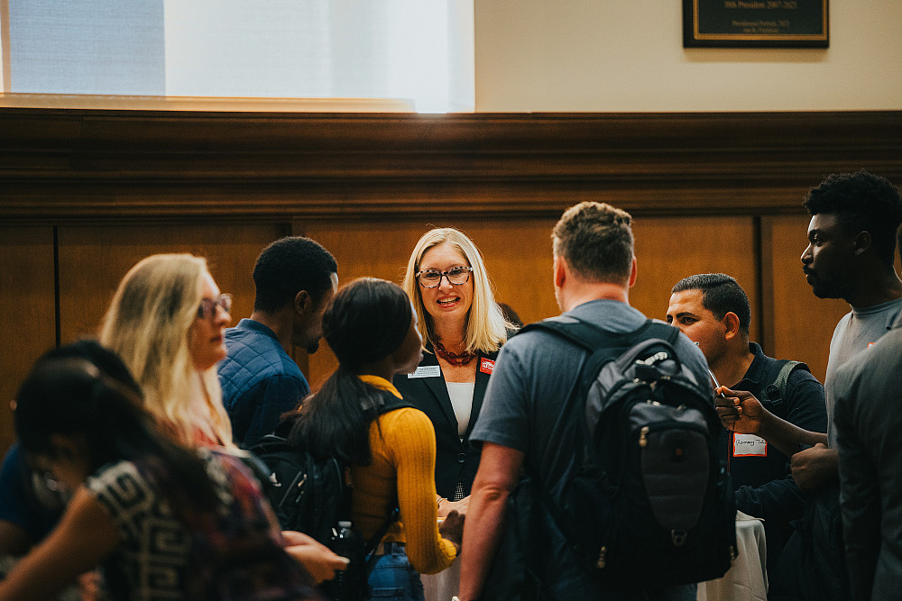 Sarah Booher mingles with students at a first generation event.