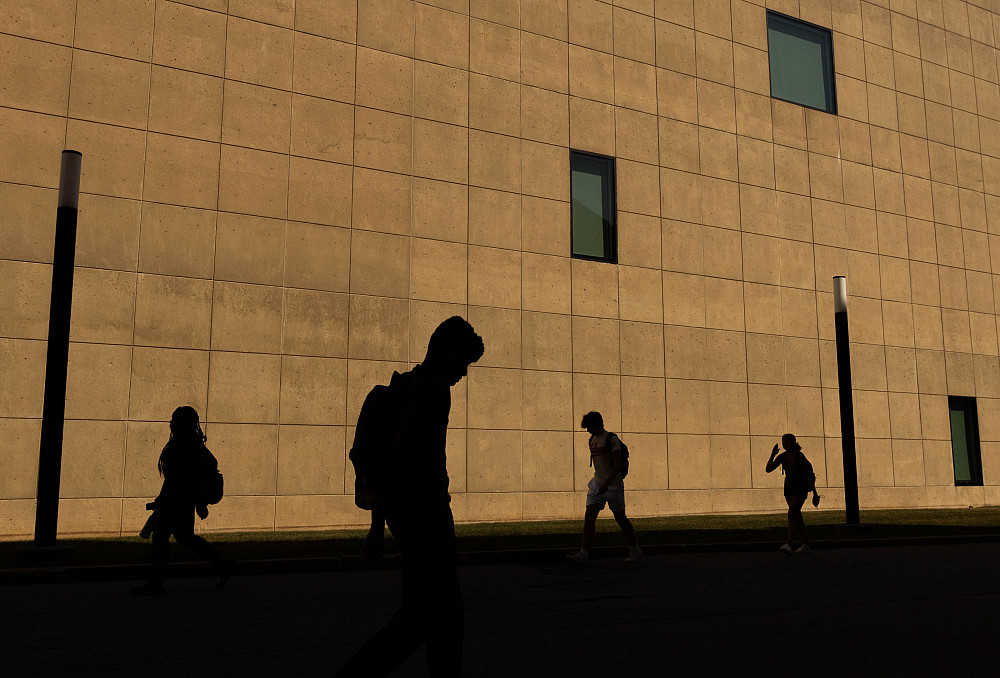Students walk around campus on the first day of classes for the fall semester at IU Bloomington on Aug. 23.