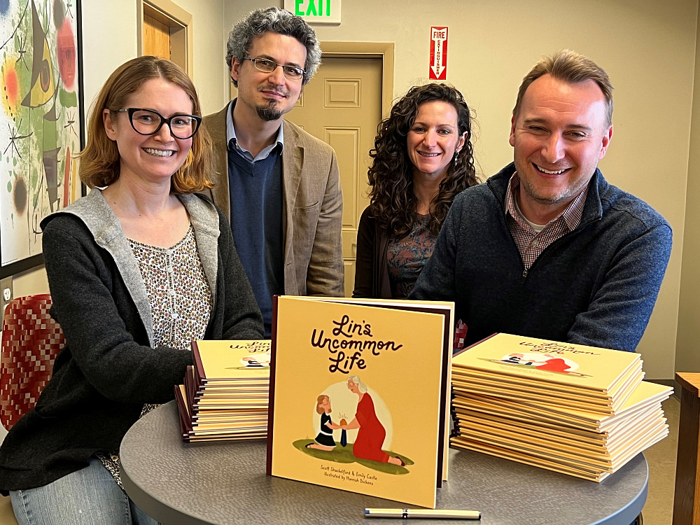 From left, co-author Emily Castle, Ostrom Workshop directors Gustavo Torrens and Jessica Steinberg, and co-author Scott Shackelford pose ...