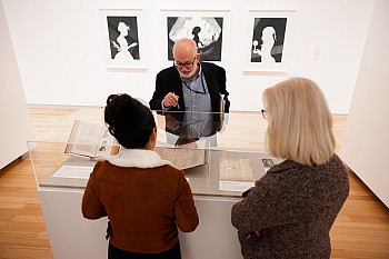 Director and Curator Joseph Mella leads a group of IU Studios staff members on a tour of the Past is Present exhibit at Herron School of ...