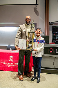 2023 Indianapolis Regional Spelling Bee Champion, Gavin Sigua (right) with Bee coordinator and IU School of Education at IUPUI Assistant ...