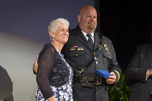 Central Division Chief Dunning receives the Medal of Valor award.