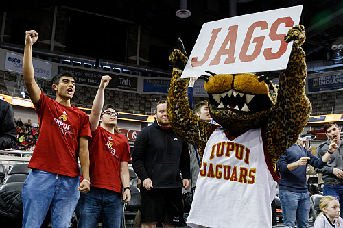 IUPUI fans cheer next to the school mascot.