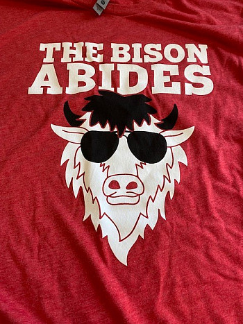 Red t-shirt with a bison photo, reading The bison abides.