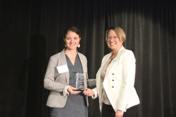 Makayla Bonney, Assistant Director of Sustain IU, accepting the Alternative Fuel Leader award for Electric from Kerri Garvin, Director of...