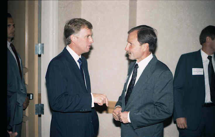Dan Quayle, left, and Gerald Bepko shake hands