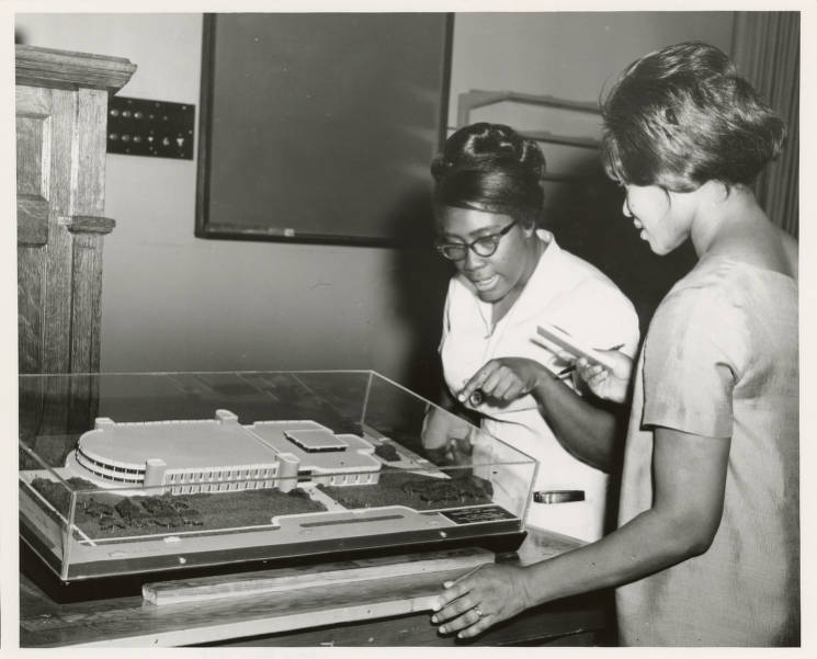 Women looking at model of proposed Law School Building, ca. 1968 UA24_PB04_1318