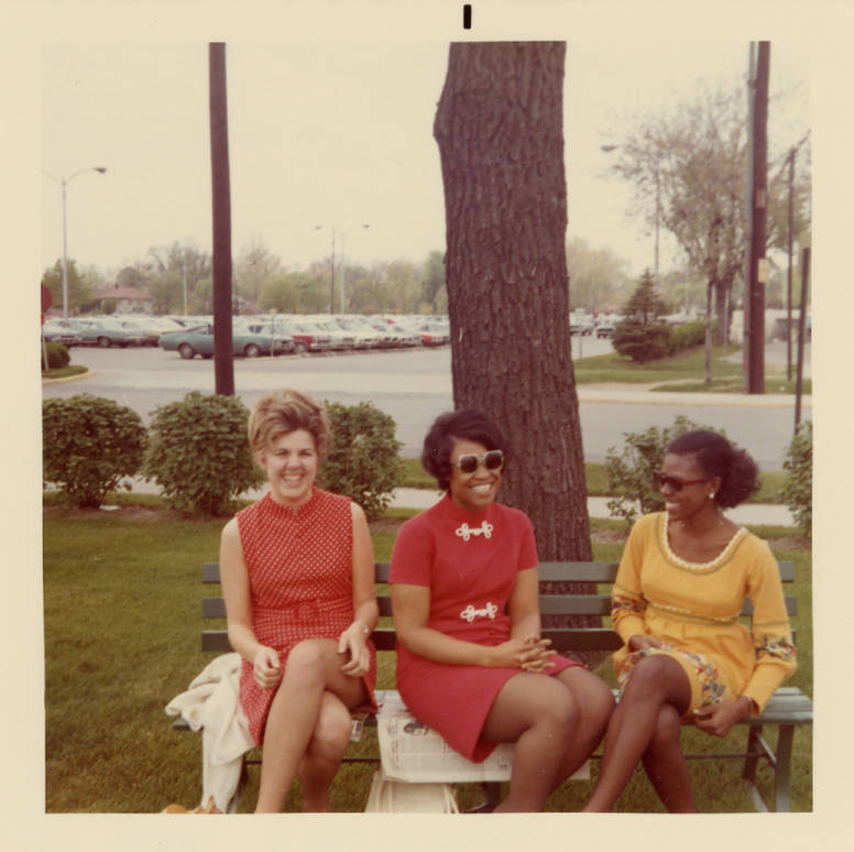 38th Street campus employees sitting under tree