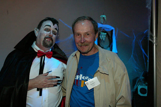 Gerald Bepko, right, stands next to a person dressed as a vampire