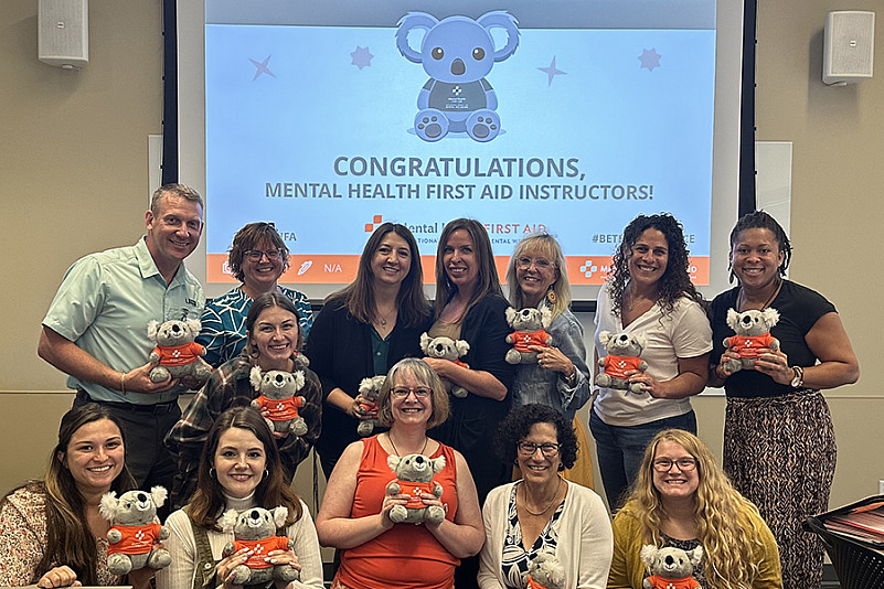 Indiana University staff and faculty who received instruction to become mental health first-aid trainers, and will share their knowledge ...