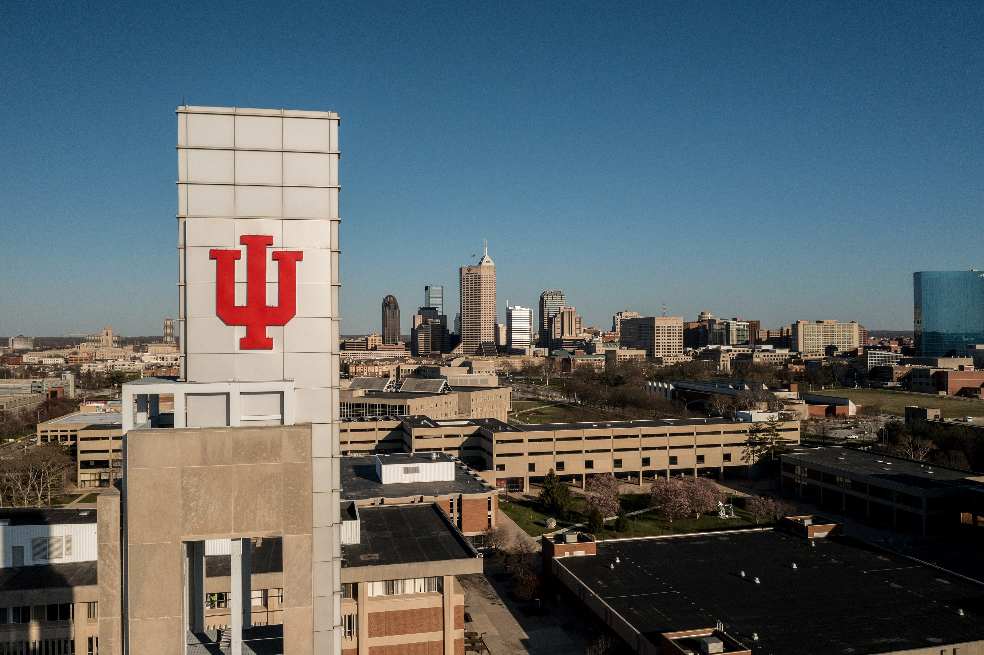 An aerial view of the IU trident affixed above the Campus Center bell tower. 