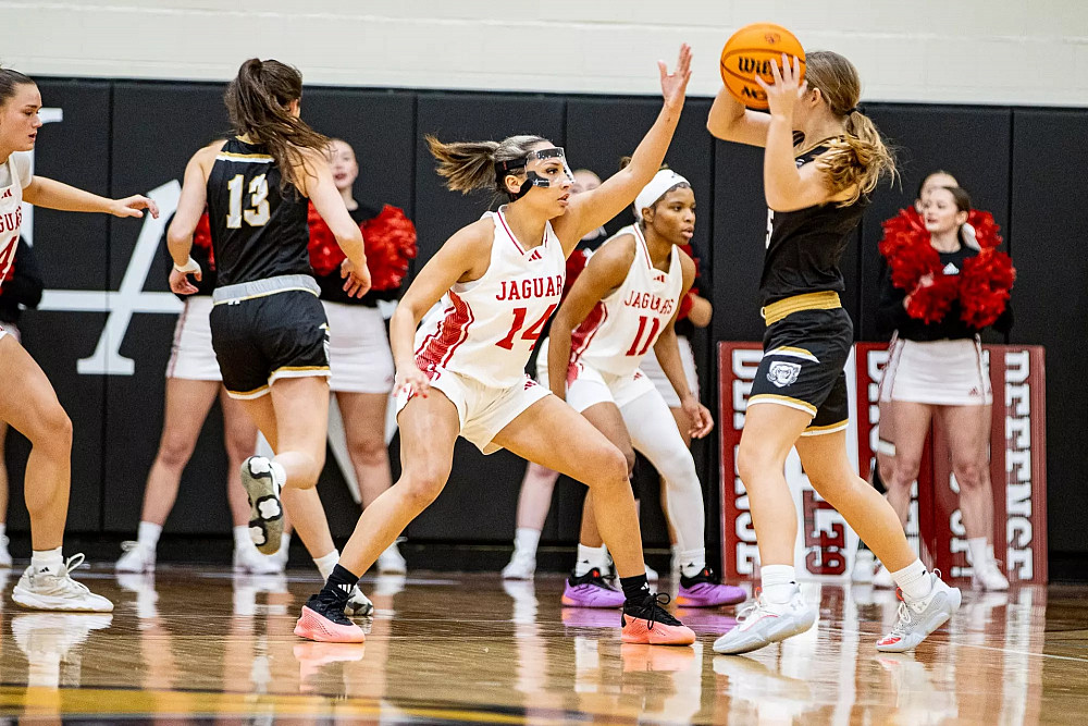 IU Indianapolis basketball player Nevaeh Foster defends a Purdue Fort Wayne player