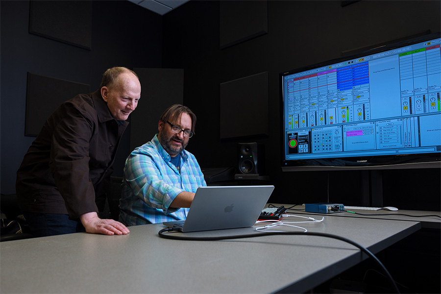 Scott Deal, left, and Jason Palamara use their AI program that can play music along with a human instrumentalist.